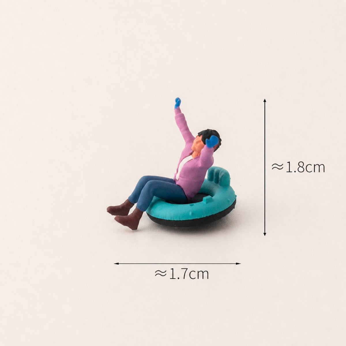 1:64 Snow Day Miniature Figure Series - Little Girl in Pink Top Riding a Snow Tube Figure