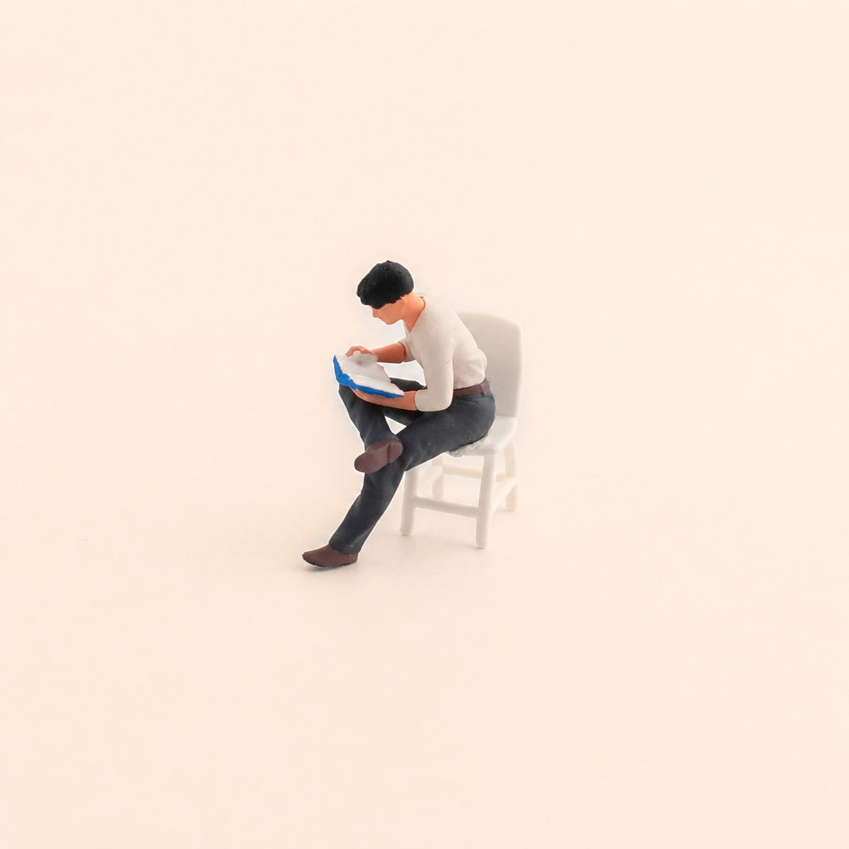 1:64 Reading Figures & Chairs Miniature Diorama Series - Seated Man in White Top Reading with White Chair Diorama Set
