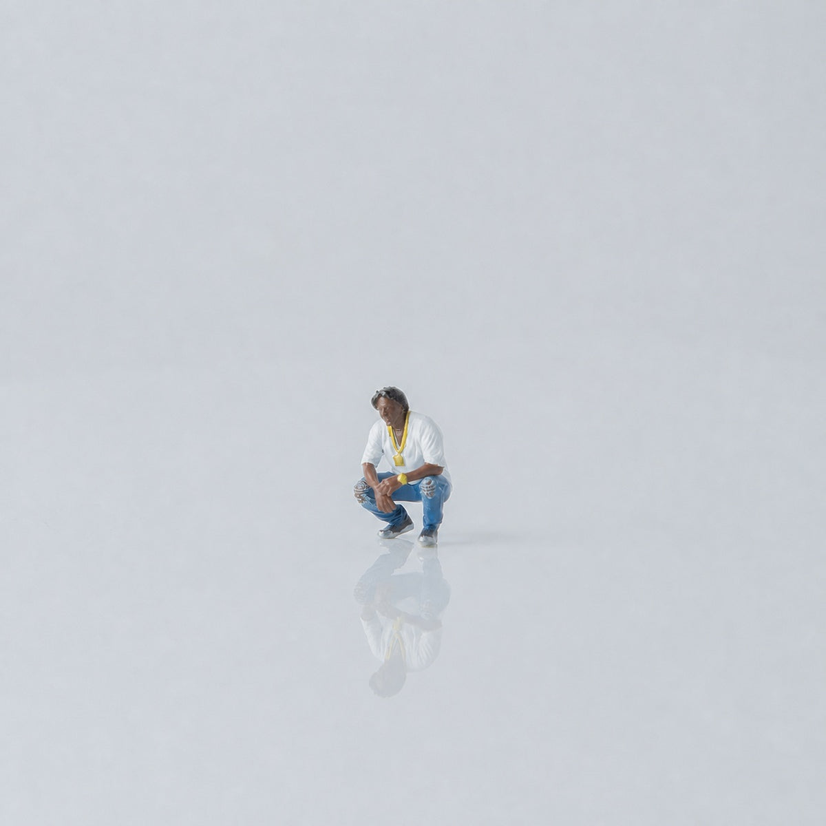 1:64 West Coast Hip-Hop Street Miniature Figure Series - Crouching Black Man with Curly Hair Figure