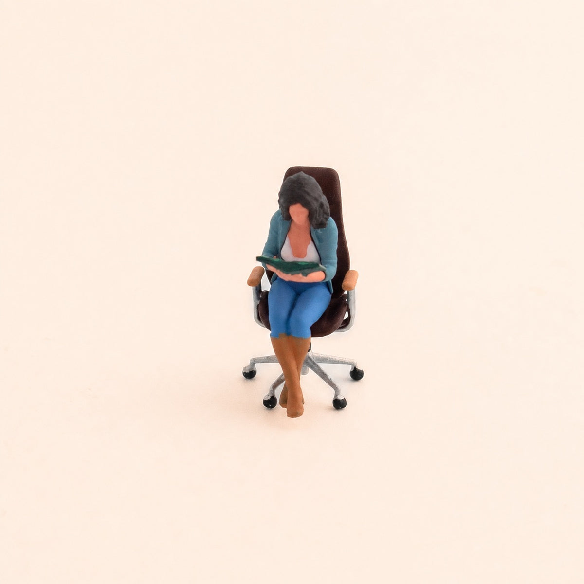 1:64 Reading Figures & Chairs Miniature Diorama Series - Seated Woman in Blue Coat Reading with Brown Ergonomic Chair Diorama Set