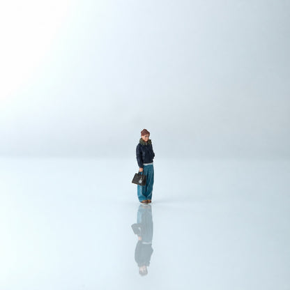 1:64 Everyday Winter Miniature Figure Series A - Standing Young Woman in Puffer Jacket Carrying a Bag Figure