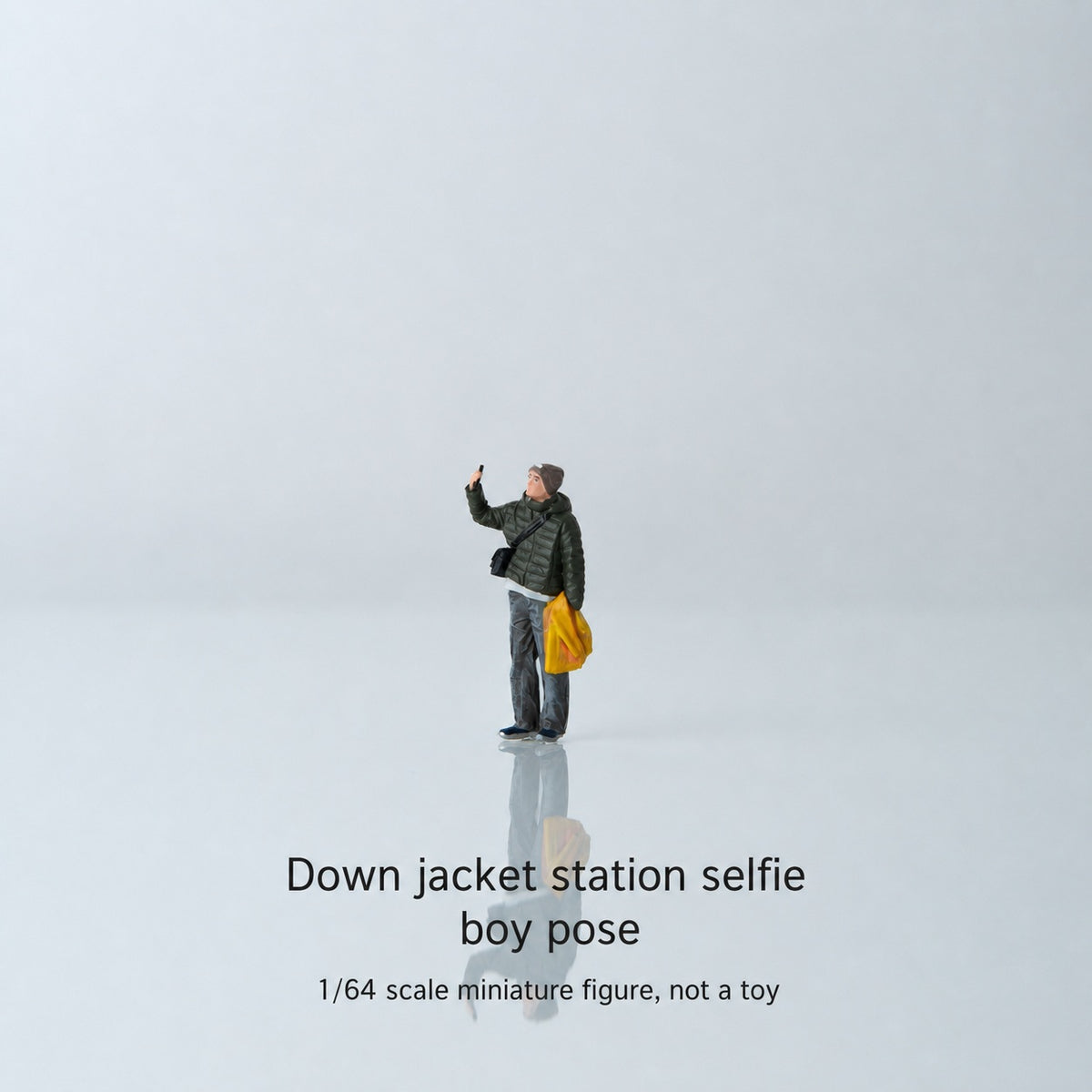 1:64 Everyday Winter Miniature Figure Series A - Standing Young Man in Puffer Jacket Taking a Photo Figure