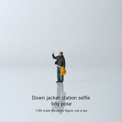1:64 Everyday Winter Miniature Figure Series A - Standing Young Man in Puffer Jacket Taking a Photo Figure