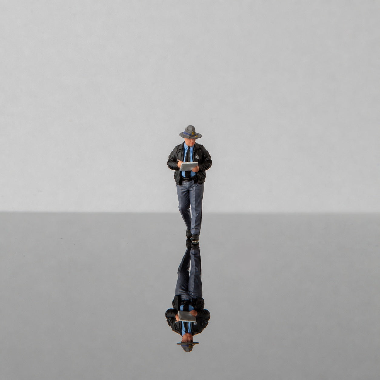 1:64 Georgia State Patrol (GSP) S1 Miniature Figure & Prop Series - GSP S1 Officer in Black Jacket Recording Details Figure