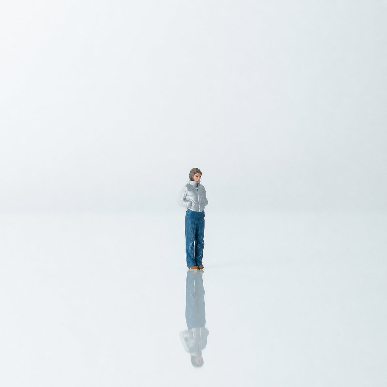 1:64 Everyday Winter Miniature Figure Series A - Standing Young Woman in Puffer Jacket with Hands in Pockets Figure