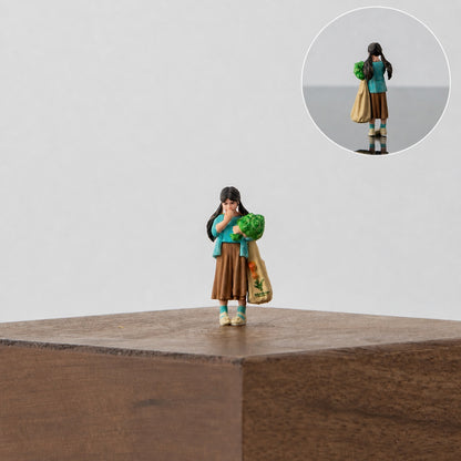 1:64 Street Shopping Miniature Figure Series - Girl Holding Vegetables and Eating a Tomato Figure