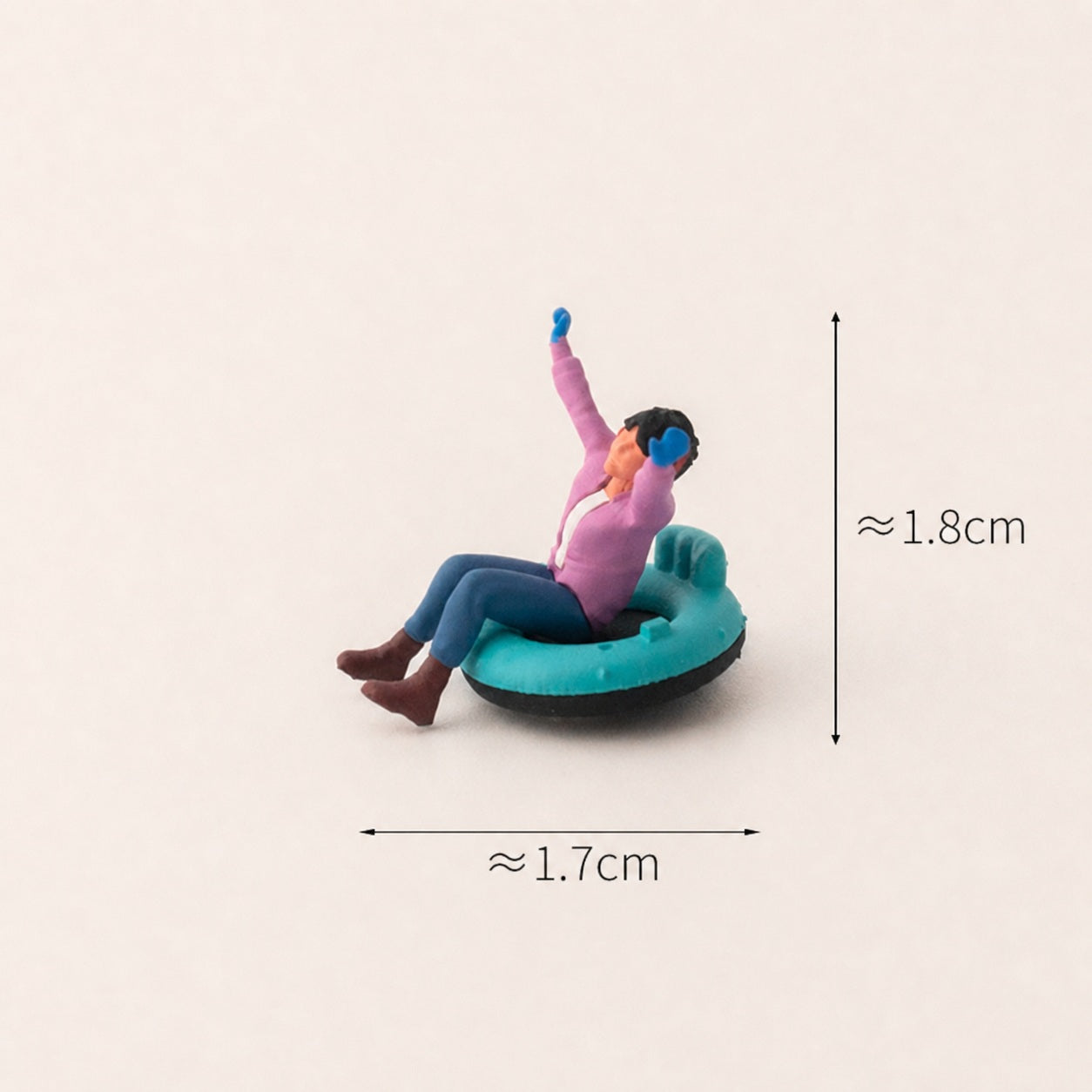 1:64 Snow Day Miniature Figure Series - Little Girl in Pink Top Riding a Snow Tube Figure