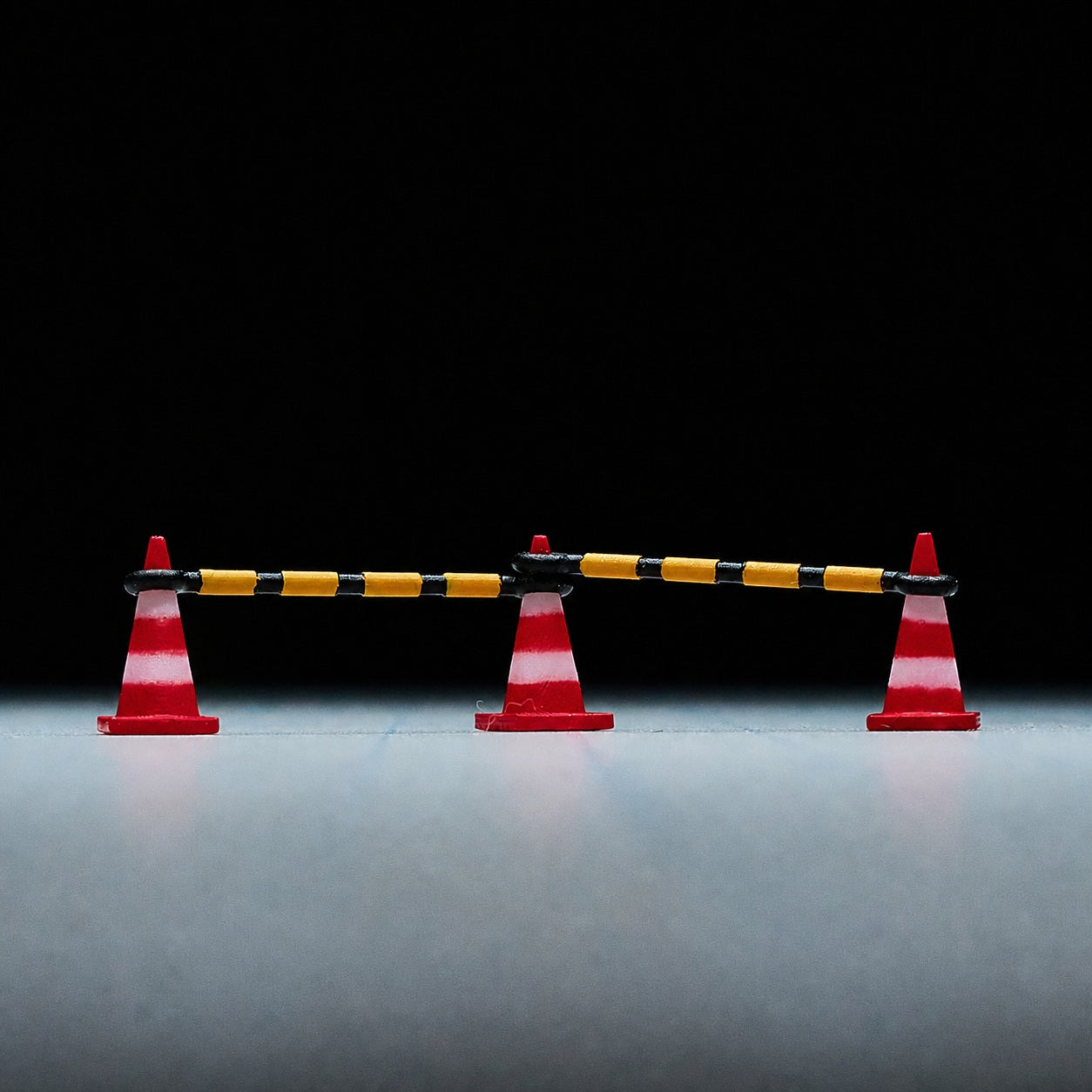 1:64 Traffic Control & Street Miniature Prop Series A - Three Traffic Cones & Two Cone Connector Bars Prop Set
