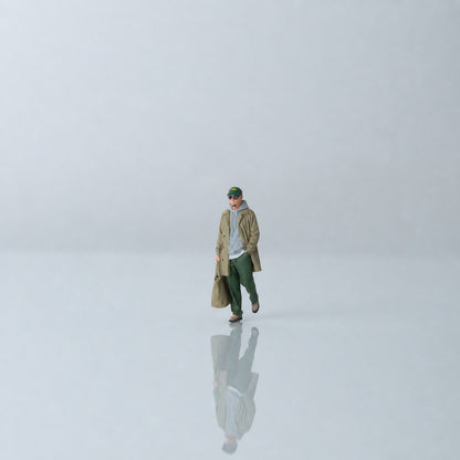 1:64 Everyday Winter Miniature Figure Series A - Walking Young Man in Trench Coat Carrying a Bag Figure