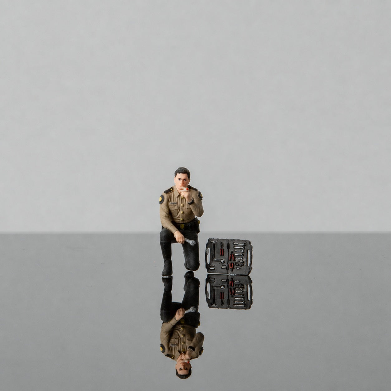 1:64 Florida Highway Patrol (FHP) S2 Motorcycle Unit Miniature Diorama Series - FHP S2 Motorcycle Officer Repairing a Bike Figure with Toolbox